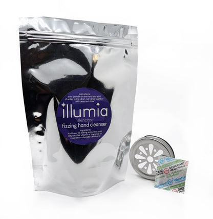 Illumia Fizzing Hand Cleanser powder in a glass jar with a metal daisy top.